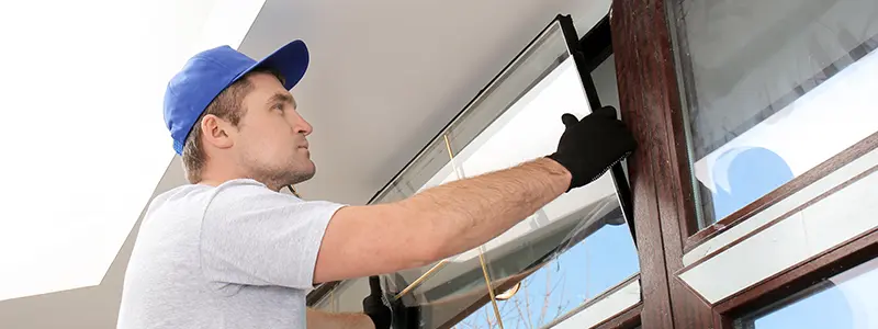 professional installing glass window after hours